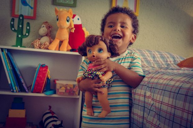 Boy playing with barbies sale